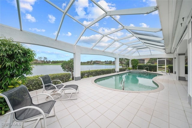 view of swimming pool with a patio, a water view, and a lanai