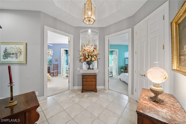 view of carpeted foyer entrance