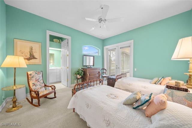 bedroom featuring french doors, ensuite bath, access to exterior, light colored carpet, and ceiling fan