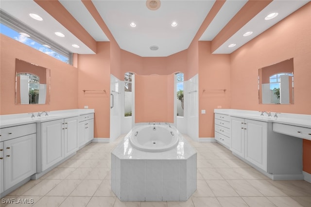 bathroom featuring vanity, tile patterned floors, and separate shower and tub