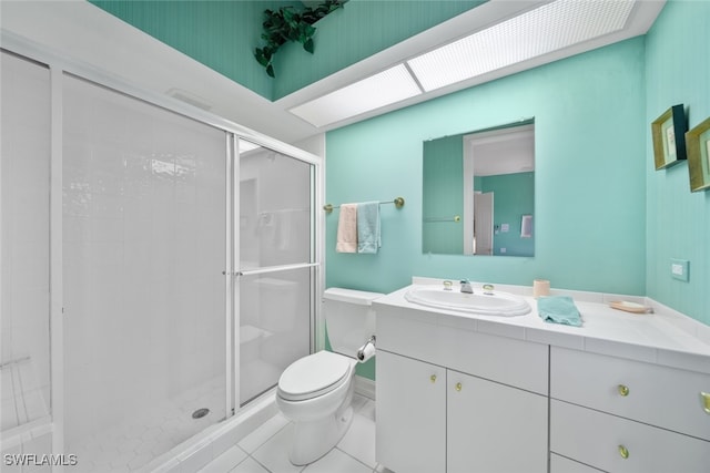 bathroom featuring vanity, walk in shower, tile patterned flooring, and toilet