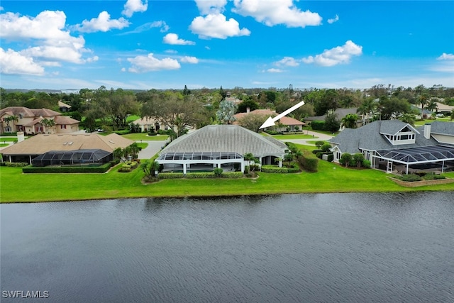 birds eye view of property with a water view