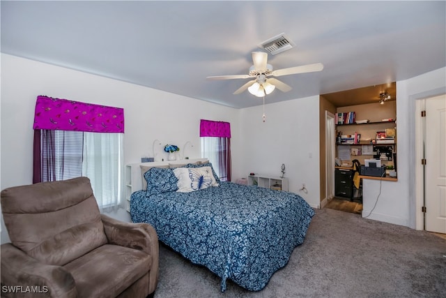 bedroom with ceiling fan and carpet