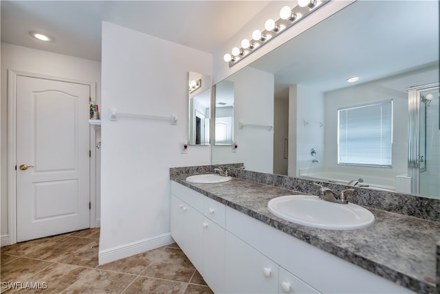 bathroom featuring vanity, tile patterned floors, and separate shower and tub