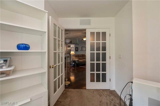 interior space featuring french doors, hardwood / wood-style flooring, and ceiling fan