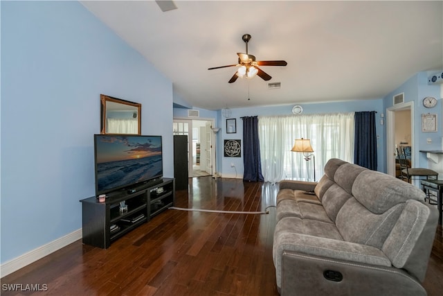 living room with vaulted ceiling, ceiling fan, and dark wood-type flooring