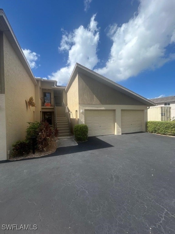 view of side of property with a garage