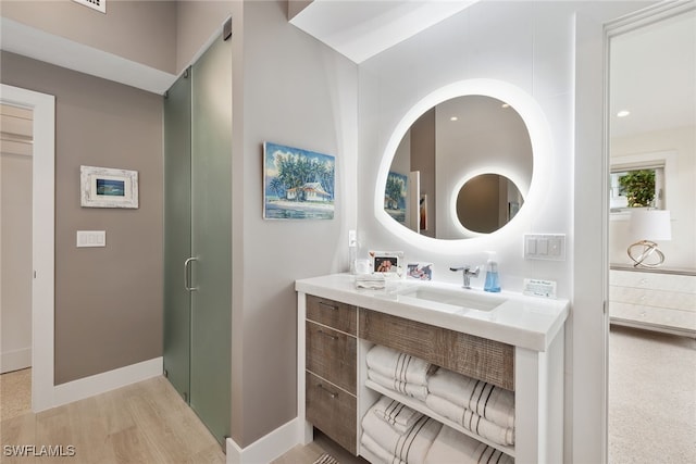 bathroom featuring vanity and wood-type flooring