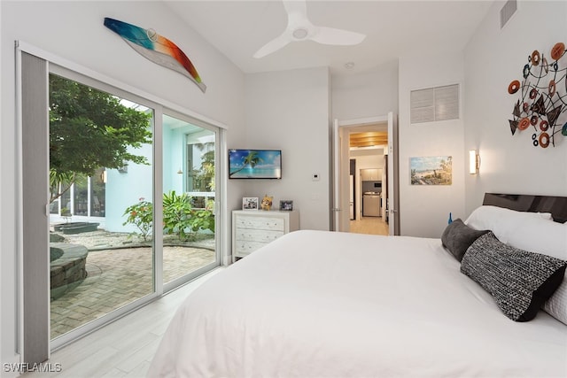 bedroom featuring access to outside, ceiling fan, and light wood-type flooring