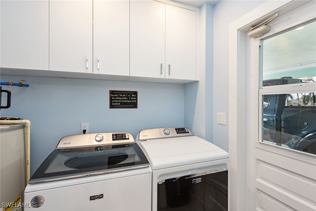 laundry room with plenty of natural light, cabinets, and independent washer and dryer