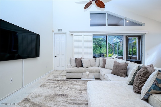 living room featuring high vaulted ceiling and ceiling fan