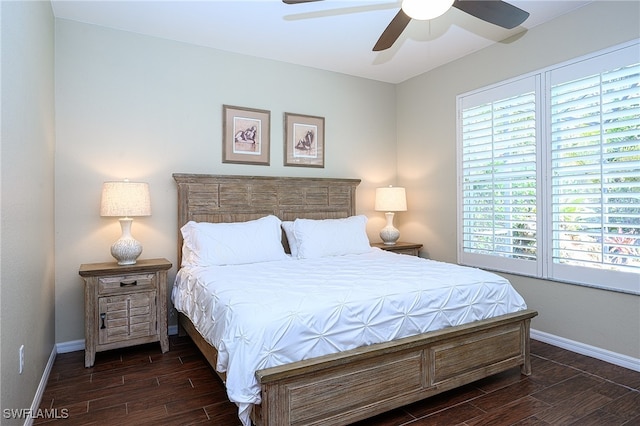 bedroom with dark wood-type flooring and ceiling fan