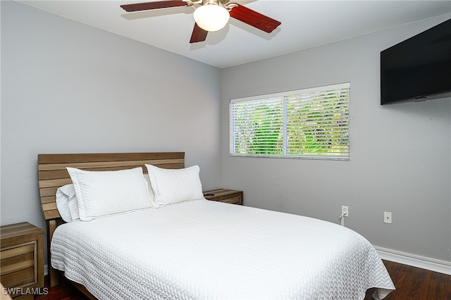 bedroom featuring dark hardwood / wood-style flooring and ceiling fan