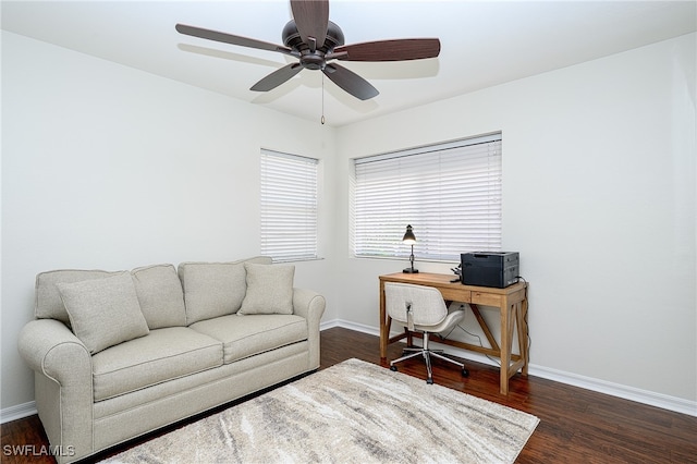 living room featuring dark hardwood / wood-style flooring and ceiling fan