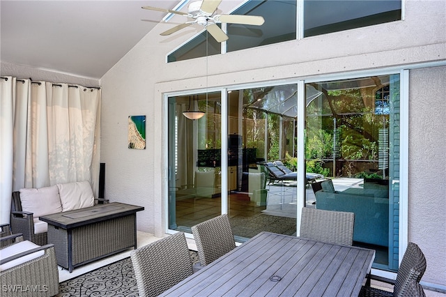 unfurnished sunroom featuring ceiling fan and lofted ceiling