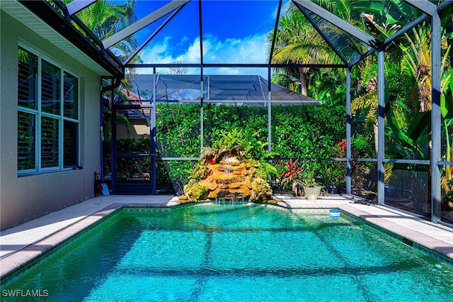 view of pool featuring a lanai and a patio