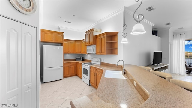 kitchen with decorative light fixtures, white appliances, sink, and ornamental molding