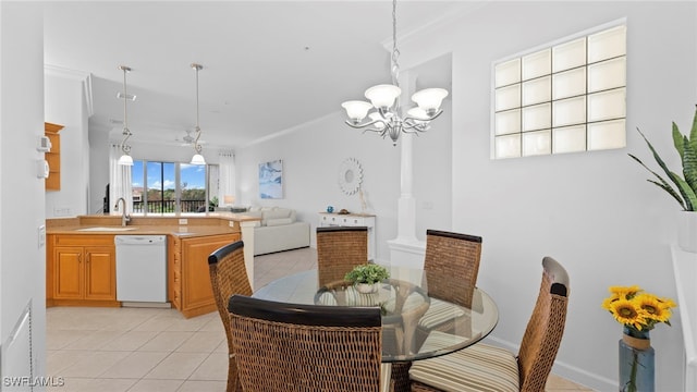 dining area with light tile patterned floors, a chandelier, sink, and crown molding