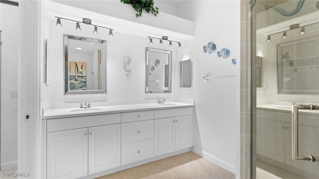 bathroom featuring vanity, tile patterned floors, and a shower with shower door