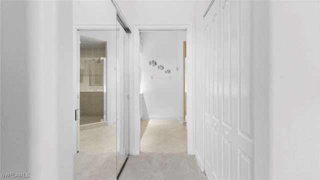 corridor with light tile patterned floors