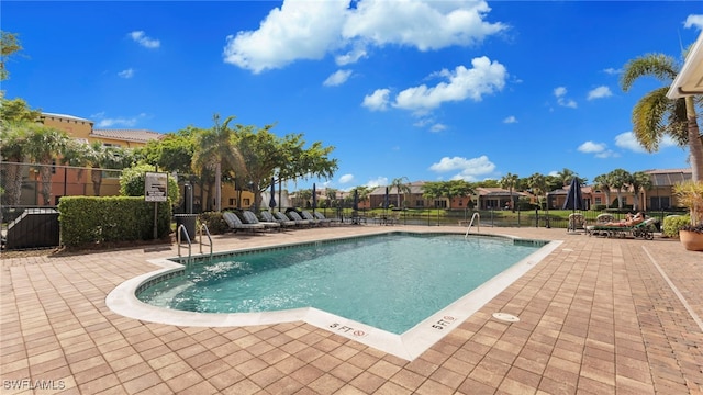 view of swimming pool with a patio area