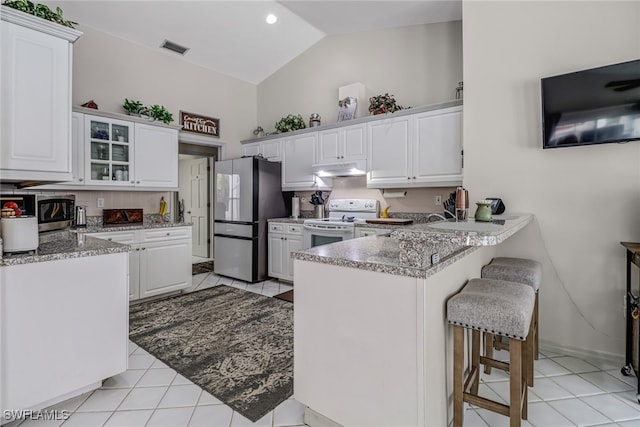 kitchen featuring kitchen peninsula, stainless steel refrigerator, white range with electric cooktop, and white cabinets