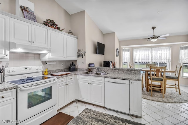 kitchen with white cabinetry and white appliances