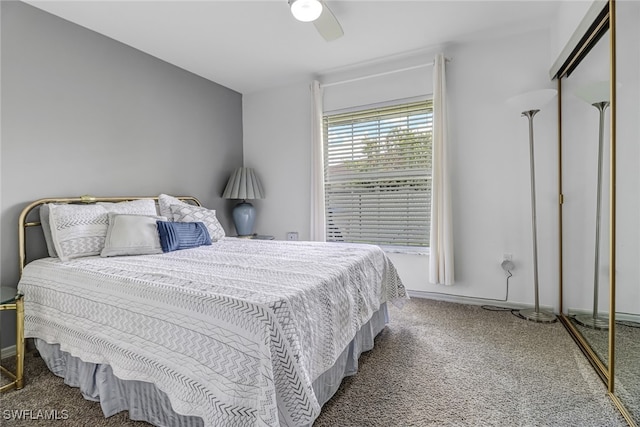 bedroom featuring ceiling fan, a closet, and carpet floors