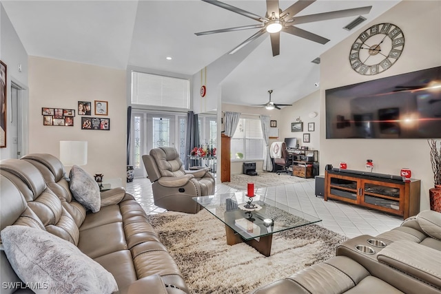 living room featuring high vaulted ceiling, light tile patterned flooring, and ceiling fan