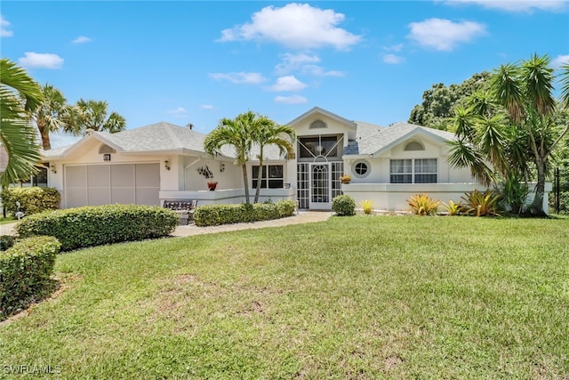 single story home with a front lawn and a garage