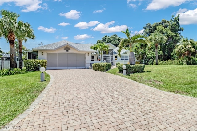 ranch-style house with a front yard and a garage