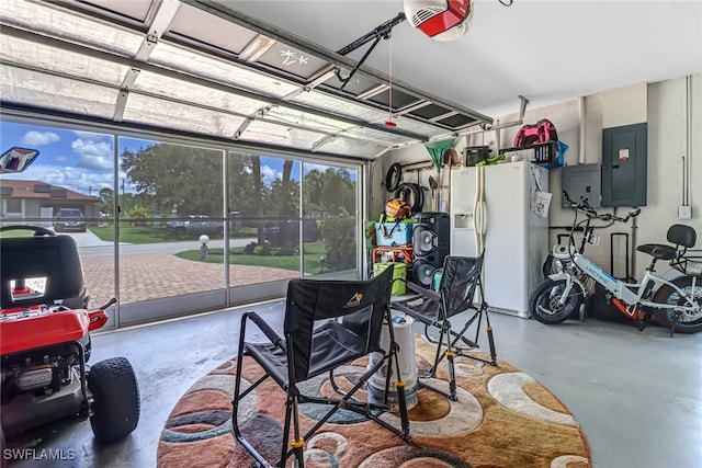 garage featuring electric panel, a garage door opener, and white fridge with ice dispenser