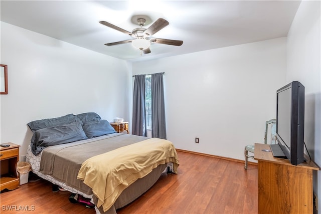 bedroom featuring hardwood / wood-style floors and ceiling fan