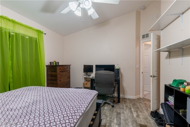 bedroom featuring light wood-type flooring and ceiling fan