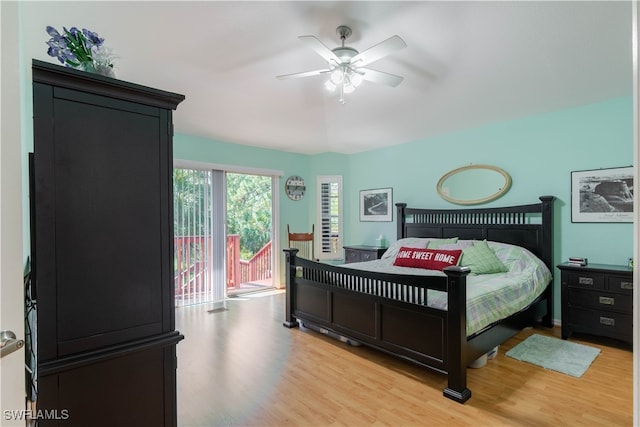 bedroom featuring access to exterior, light wood-type flooring, and ceiling fan