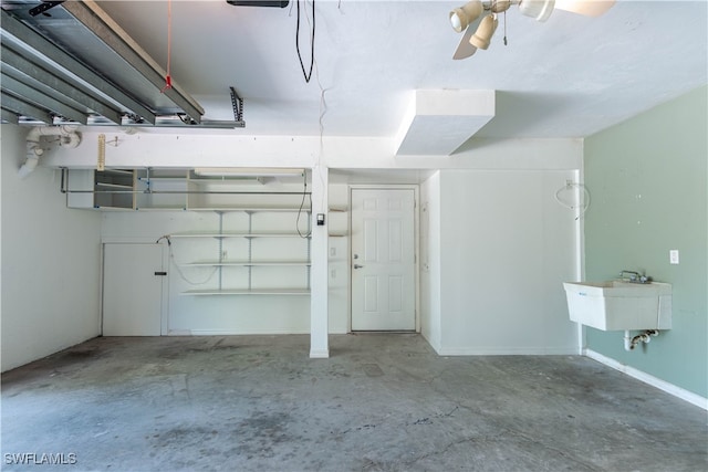 interior space with sink and ceiling fan