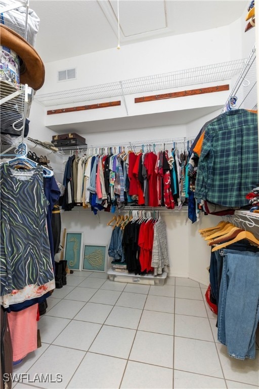 spacious closet featuring tile patterned floors