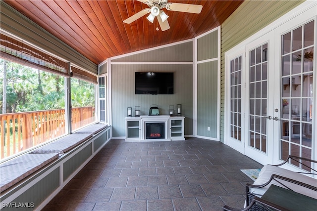 unfurnished sunroom with wooden ceiling, ceiling fan, french doors, and lofted ceiling