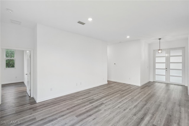 unfurnished room with light hardwood / wood-style flooring