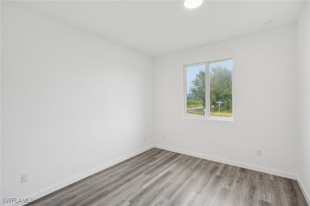 spare room featuring light hardwood / wood-style flooring