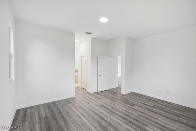 unfurnished room featuring hardwood / wood-style floors