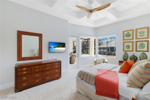 carpeted bedroom featuring access to outside, ceiling fan, and coffered ceiling