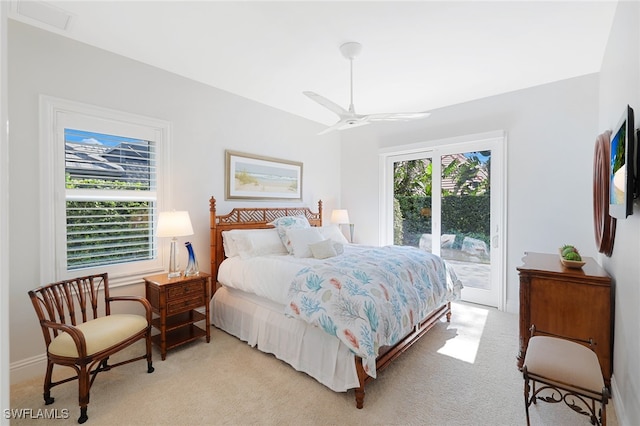 bedroom featuring access to exterior, ceiling fan, and light colored carpet