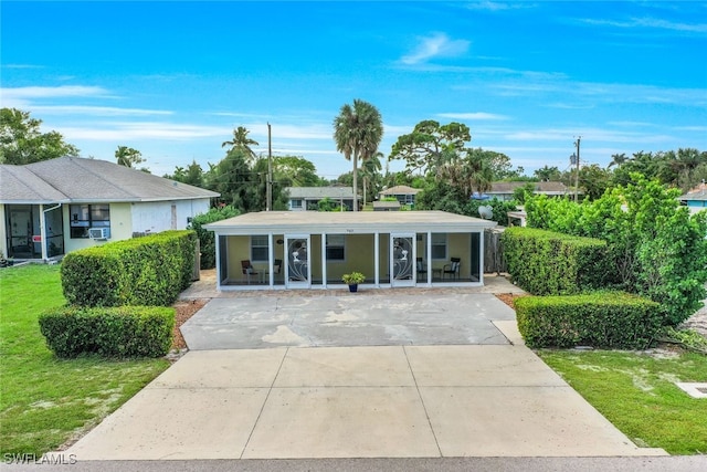 ranch-style home featuring a front yard