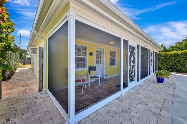 view of patio with a sunroom