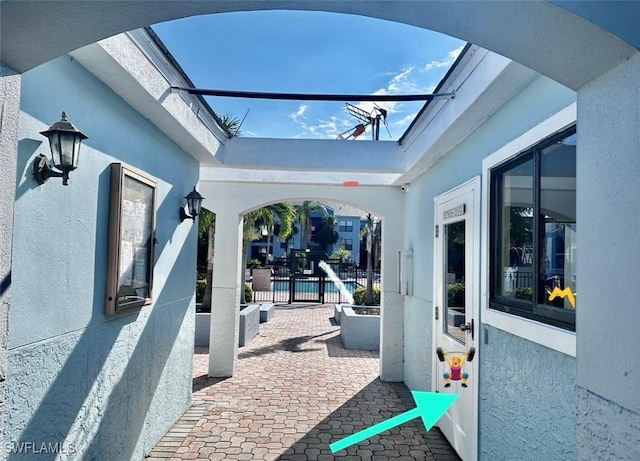 view of patio featuring fence