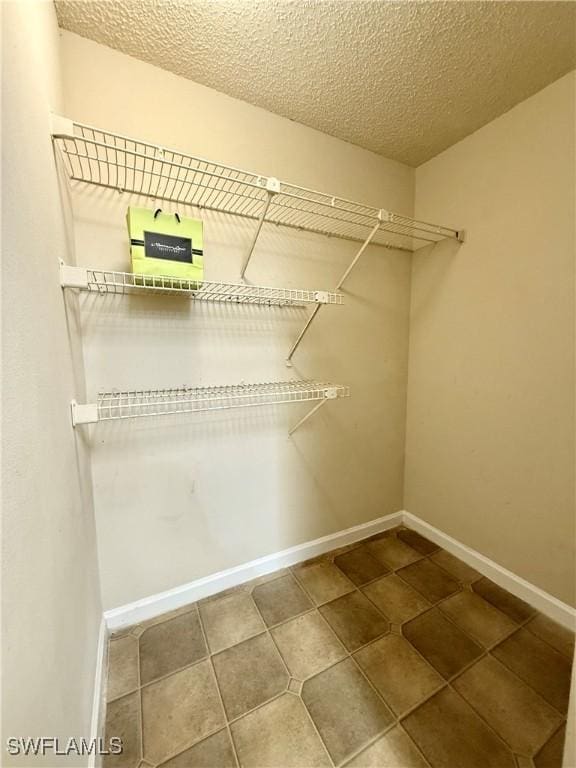 walk in closet featuring tile patterned floors