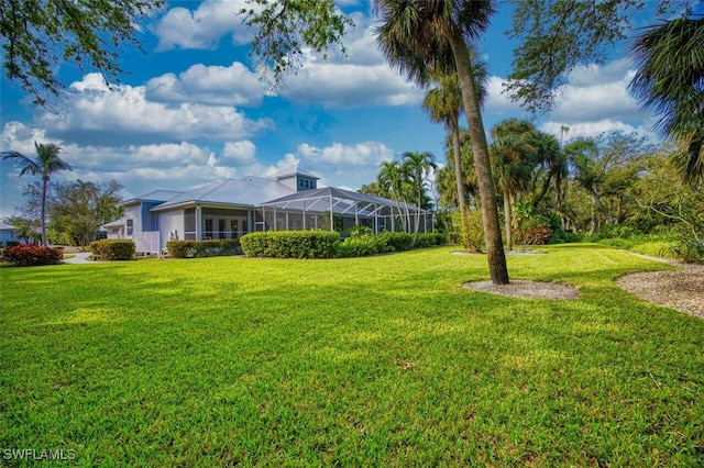 view of yard with a lanai