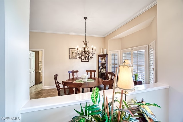 dining space featuring an inviting chandelier and crown molding