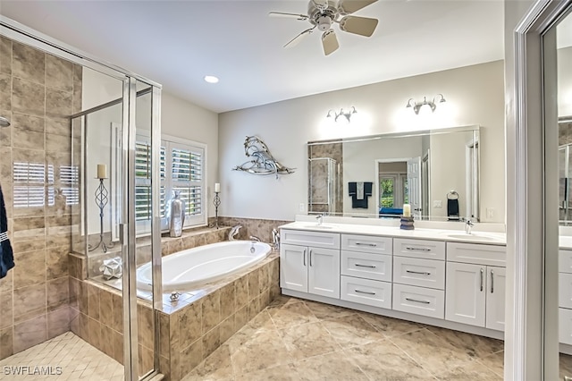 bathroom featuring vanity, ceiling fan, tile patterned floors, and plus walk in shower